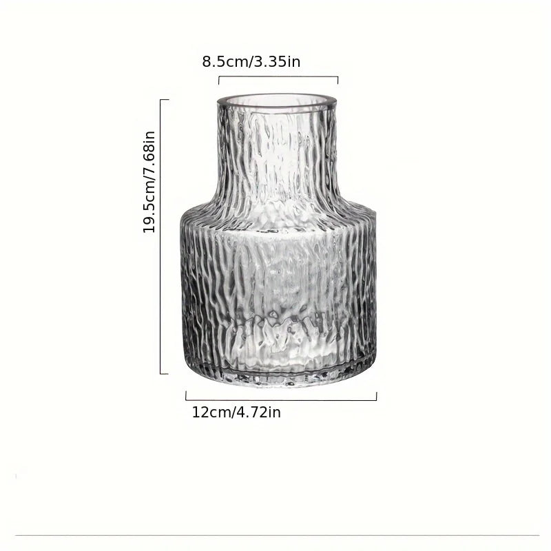 Glacier textured wide mouth glass vase on marble surface with clean background