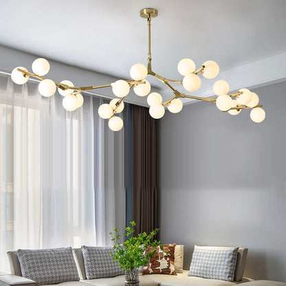 Golden iron branch chandelier with frosted glass shade heads