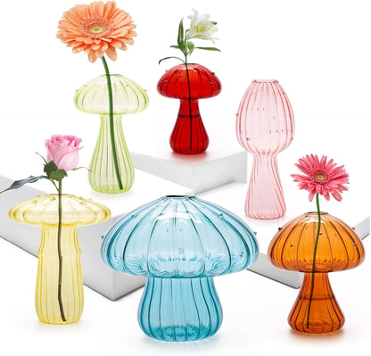 Clear glass mushroom-shaped bud vase for single flower stem tabletop display
