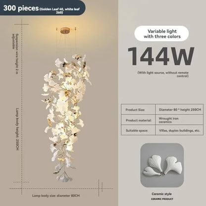 Overlapping leaf shades on a tall ginkgo chandelier for a reception table