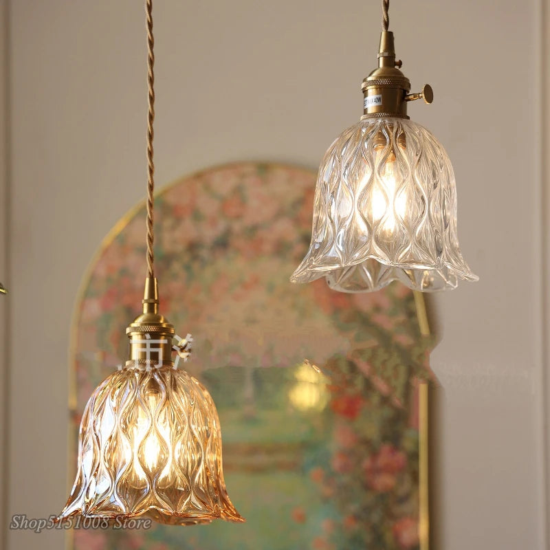green glass wall sconce, detail view of fixture base and arm