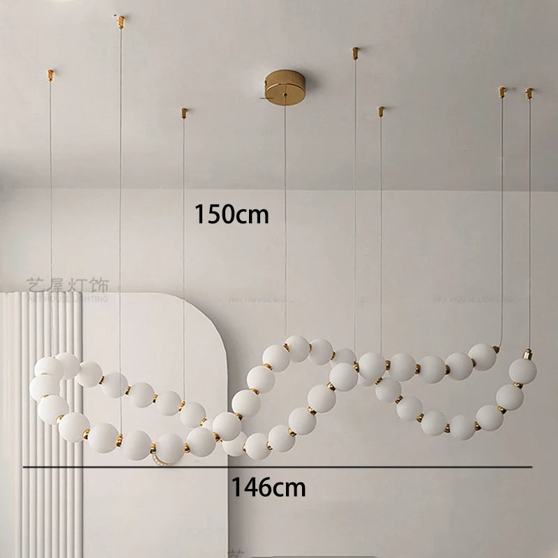 Gold linear strip chandelier with cold white LED light output