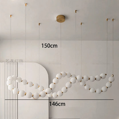 Gold linear strip chandelier with cold white LED light output
