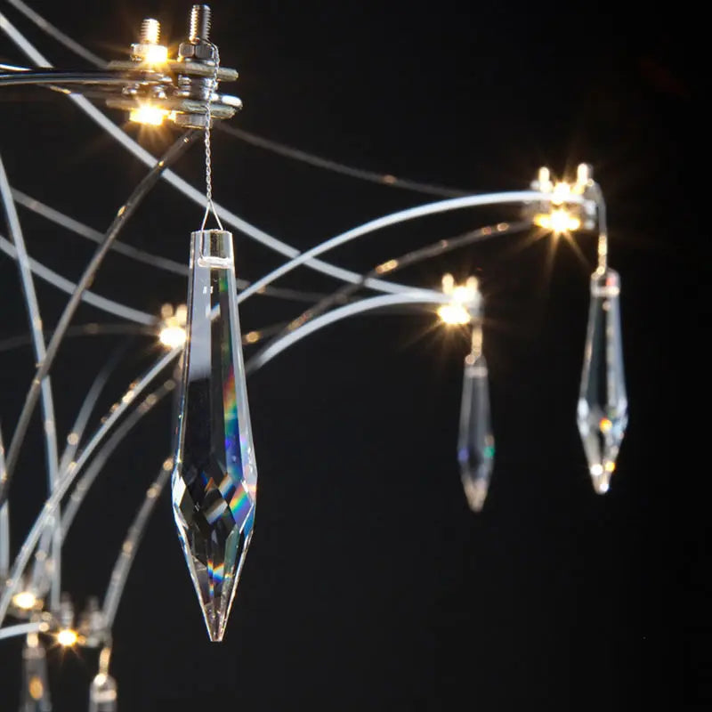 Radiating crystal arms on a polished gold art deco chandelier body