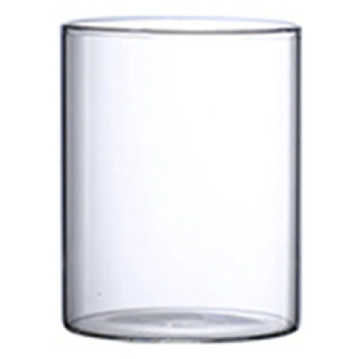 Tall glass cylinder vase 6.5x12 cm with single amaryllis stem in styled interior