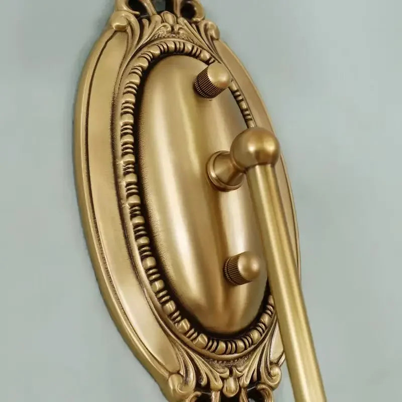 copper wall sconce, detail view of fixture base and arm