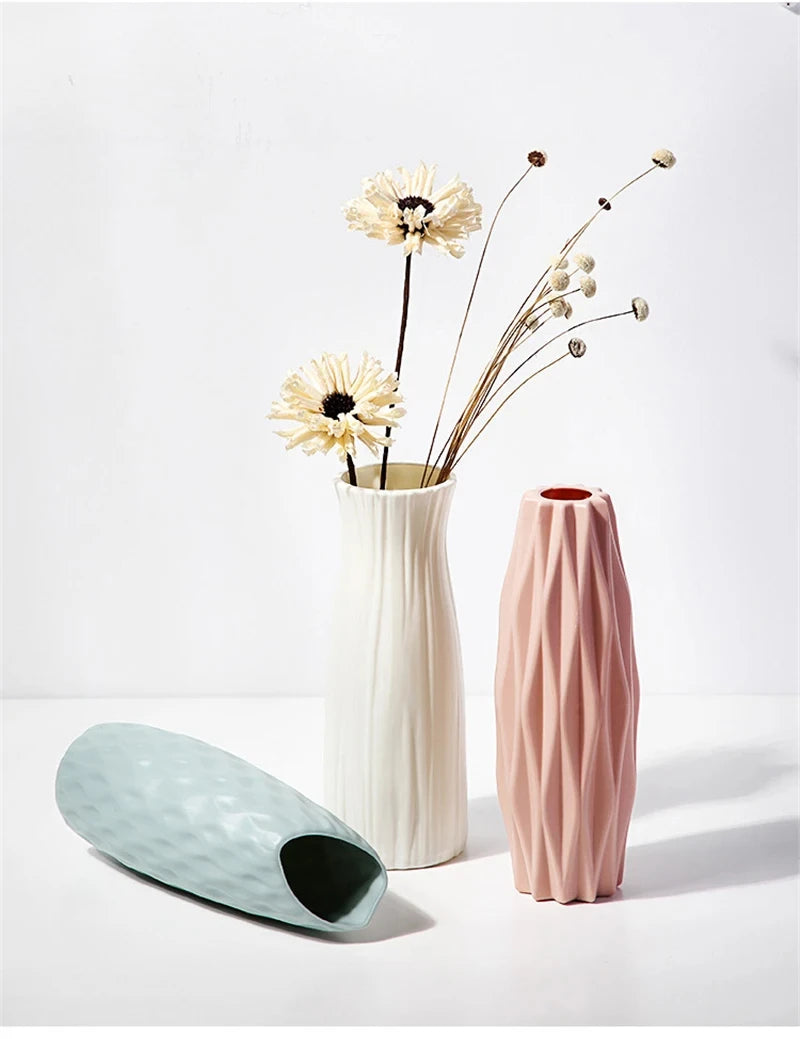 White plastic minimalist vase with single dried stem in Scandinavian interior