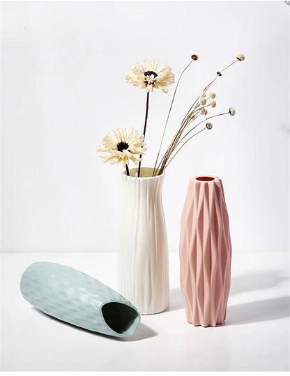 White plastic minimalist vase with single dried stem in Scandinavian interior