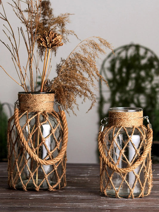 Rustic glass vase wrapped in hand-tied hemp rope netting on farmhouse shelf