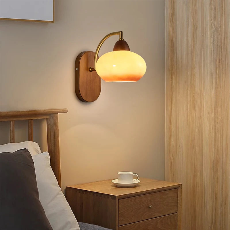 glass wall sconce, detail view of fixture base and arm