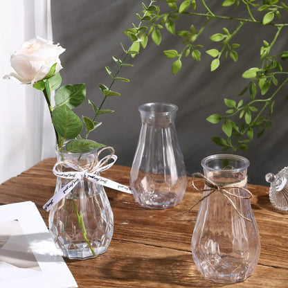 Diamond pattern transparent plastic vase with fresh flowers on dining table