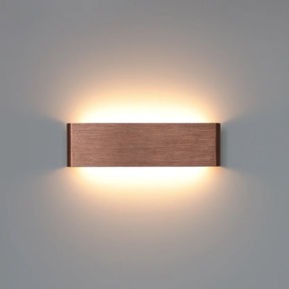 gold aluminum wall sconce, front view on white background
