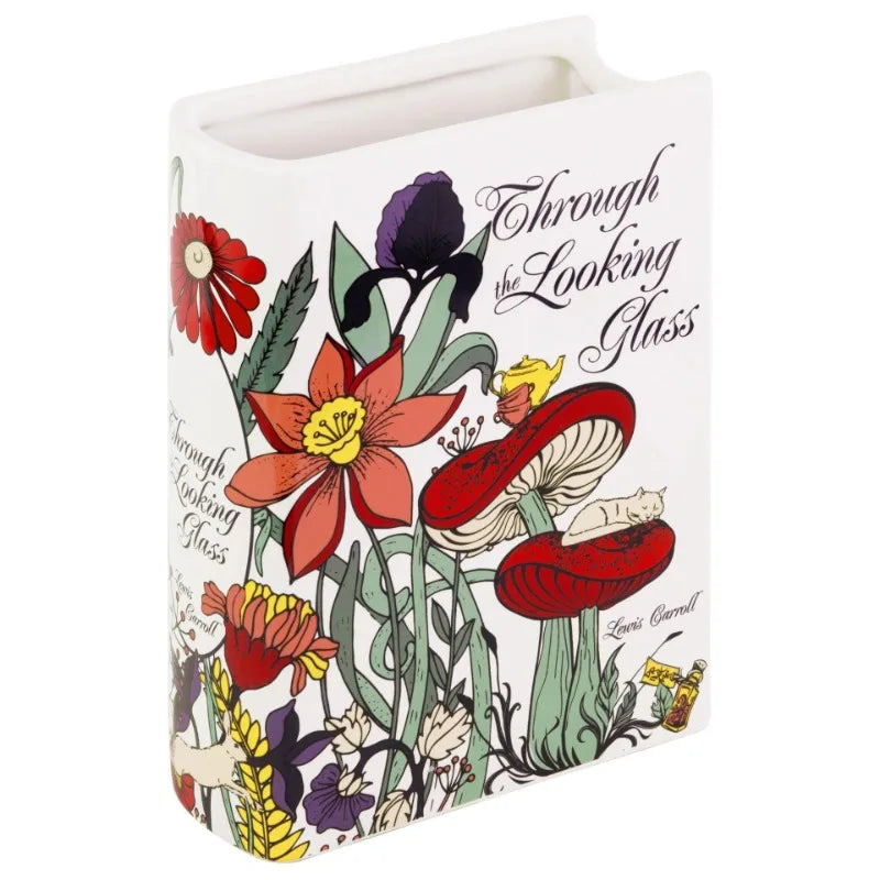 White ceramic book vase with pampas grass on minimalist floating shelf