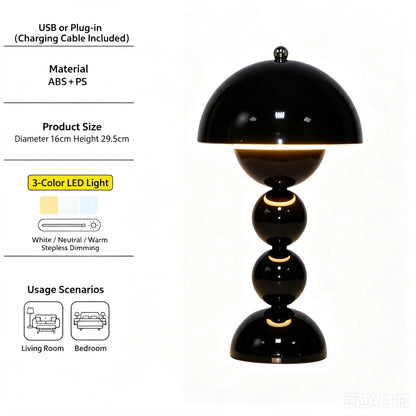 Flower bud lamps in wine red, black, and yellow displayed side by side