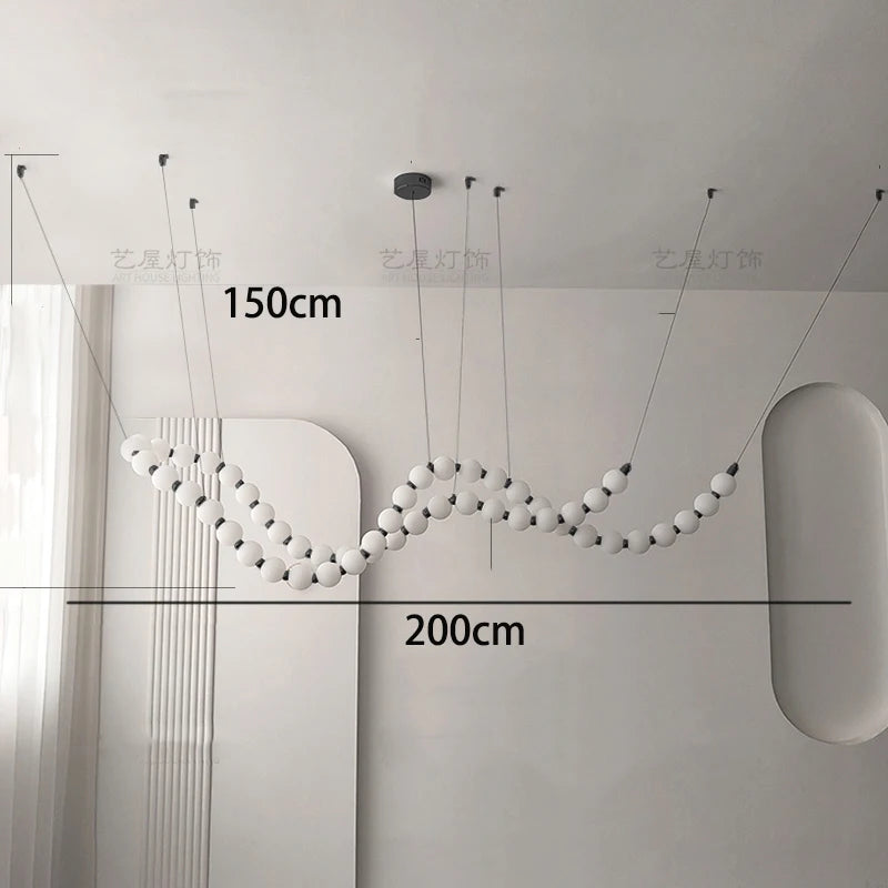 Black linear strip chandelier at 57.5 in length with warm light