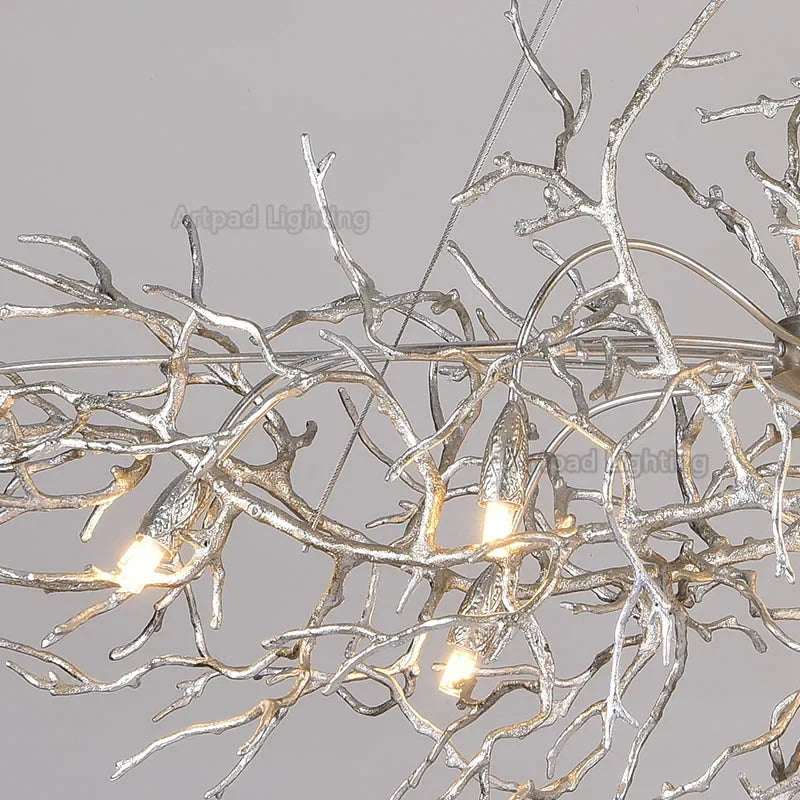 Gold Color C crystal chandelier with cold white light over a table