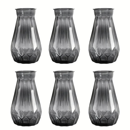 Transparent diamond facet plastic vase holding white roses for formal table