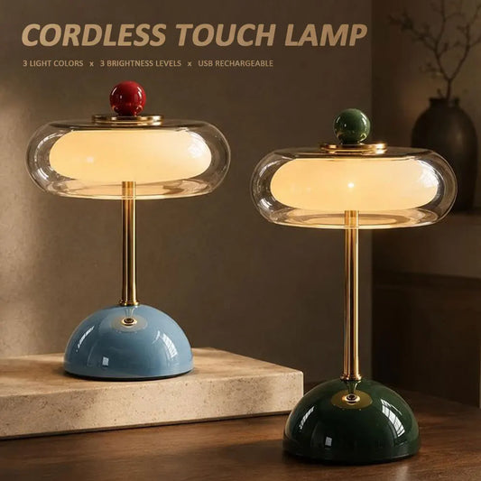 Mid-century glass desk lamp with gold metal pole on bedroom nightstand