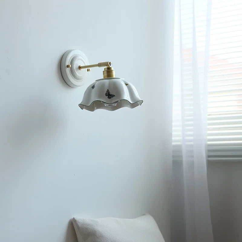 brass wall sconce, front view on white background