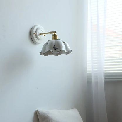 brass wall sconce, front view on white background