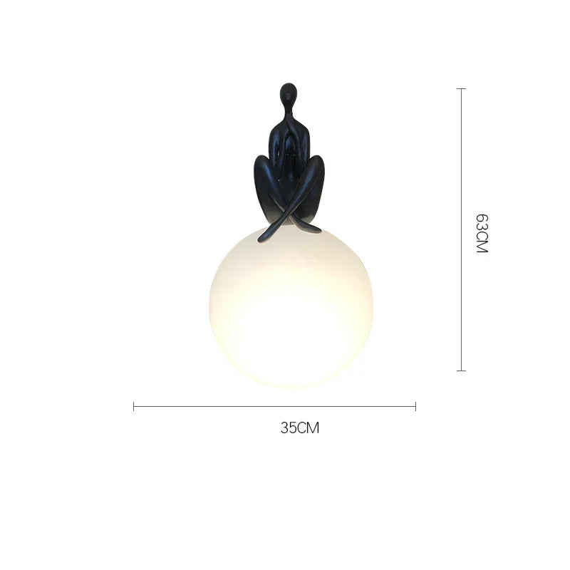 Art portrait floor lamp illuminated white light casting glow on bedroom wall