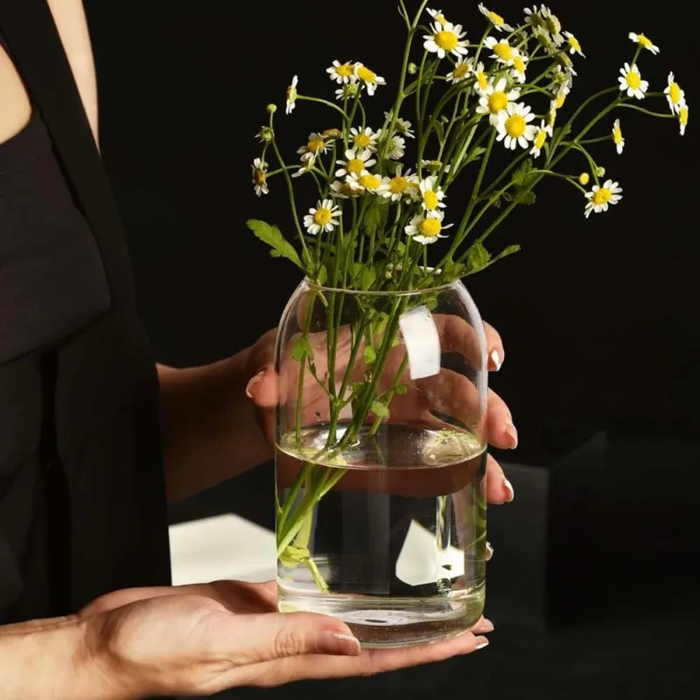Set of three modern glass flower vases in S, M, and L sizes together