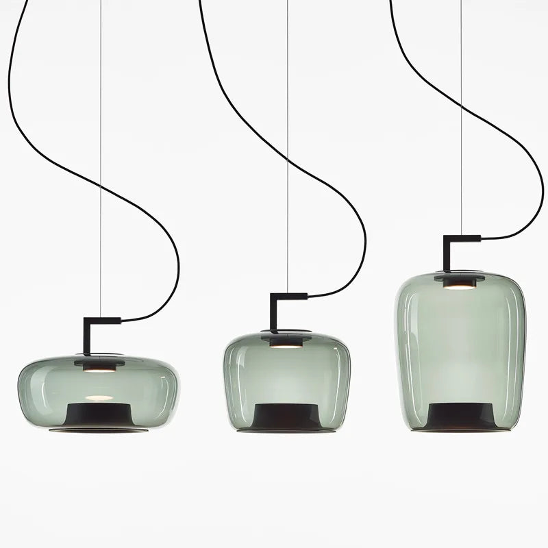 Green double glass chandelier shade giving a soft hazy glow