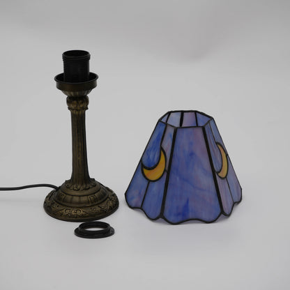 Purple glass lamp switched off showing unlit stained glass detail
