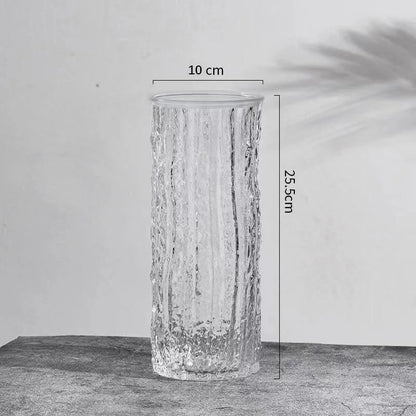 Transparent glacier textured glass vase with tropical monstera leaf stem display