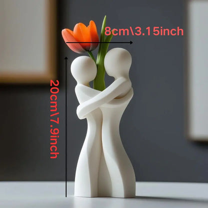 White and red ceramic hugging figure vases displayed together as romantic Valentine's gift set
