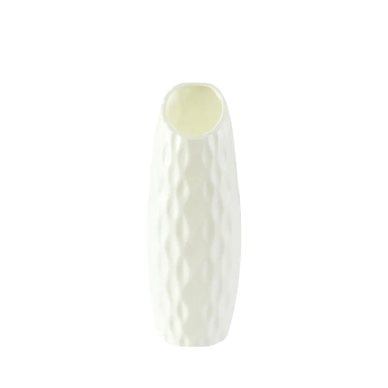 Zhi Qiao style Nordic plastic vase holding dried botanical stems on shelf