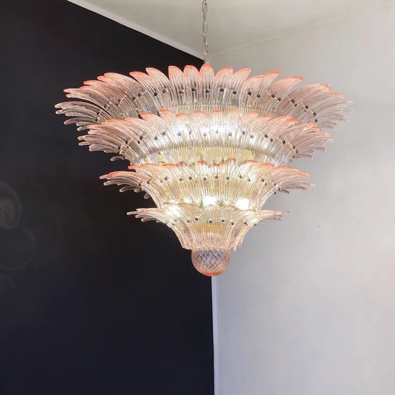 Mid century glass chandelier hung on a chain pendant from the ceiling