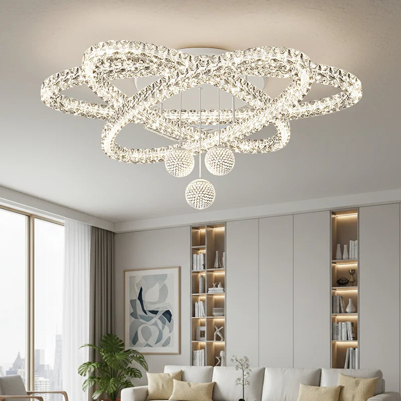 Brushed steel and acrylic chandelier with a surface mounted ceiling plate