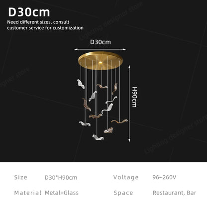 Linear glass chandelier lit in white 6000K light on plated metal