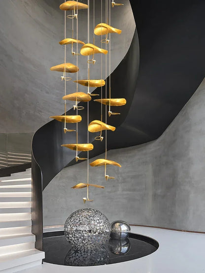 Natural polished copper lotus shades hung at staggered heights