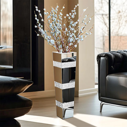 Tall mirrored silver crystal floor vase with polished finish in living room