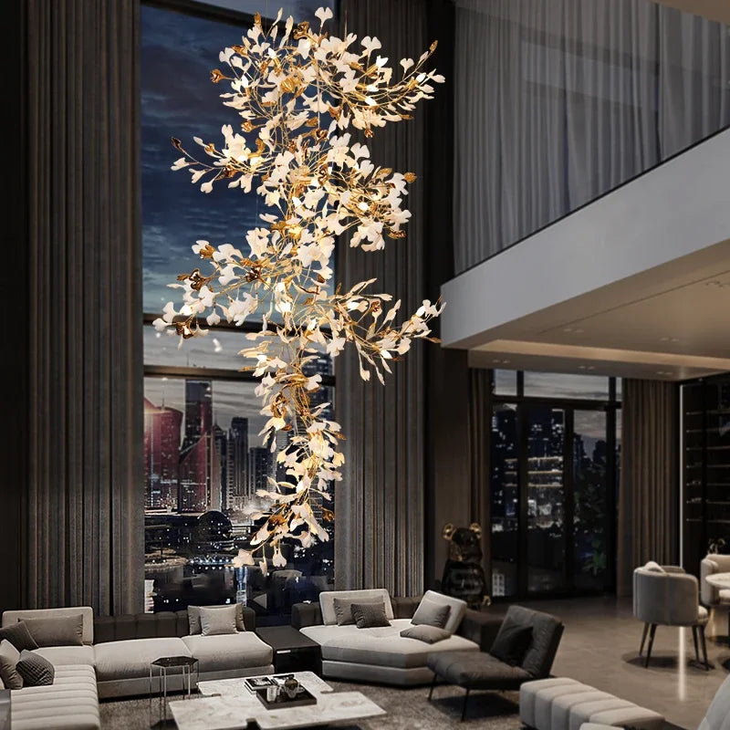 Ceramic ginkgo leaf chandelier with overlapping lit leaves on a slim frame