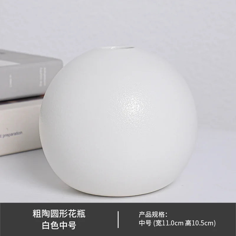 Medium white ball ceramic vase styled with dried pampas on wooden bookshelf