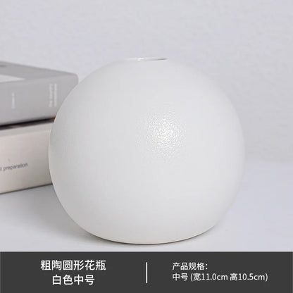 Medium white ball ceramic vase styled with dried pampas on wooden bookshelf