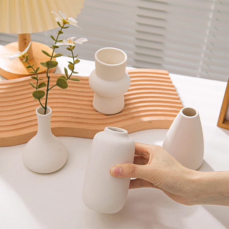 White ceramic retro bottle vase with dried flowers display