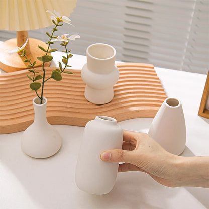 White ceramic retro bottle vase with dried flowers display