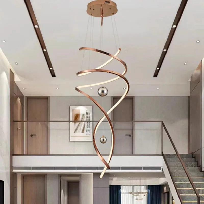 Rose gold cascading staircase chandelier for double height entry stairwells