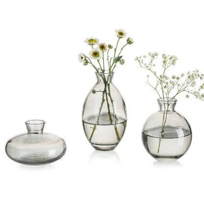 Grey A style mini glass vase with dried botanical stem on desk