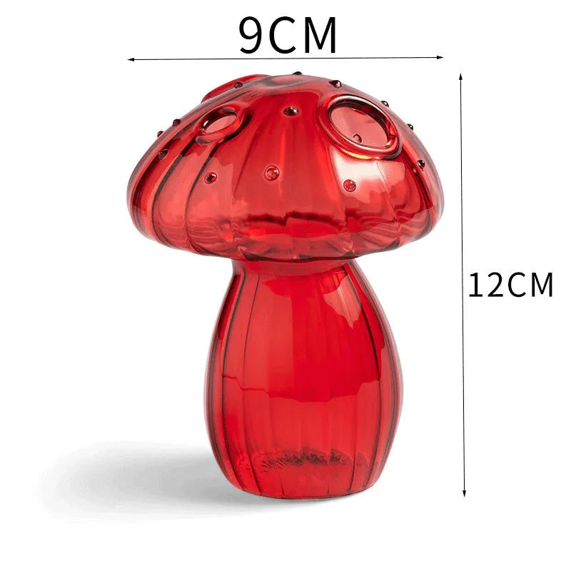 Transparent mini mushroom vase with trailing ivy cutting in water