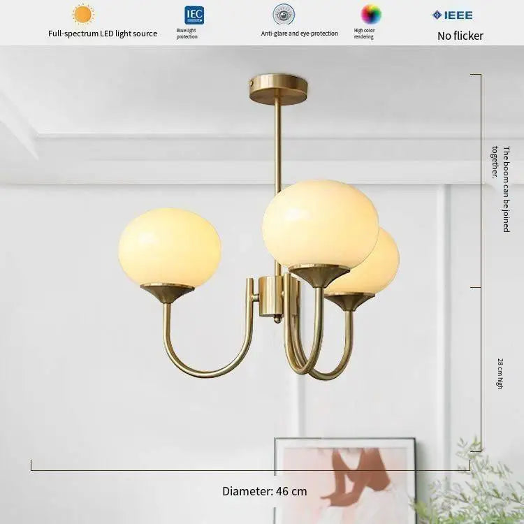 Frosted glass ball chandelier shown in neutral white LED light