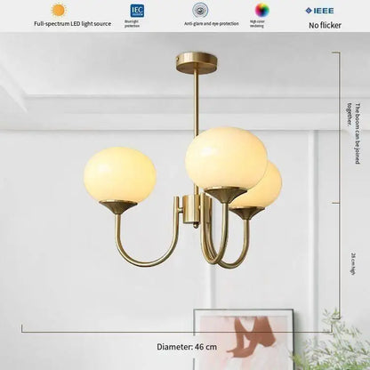 Frosted glass ball chandelier shown in neutral white LED light