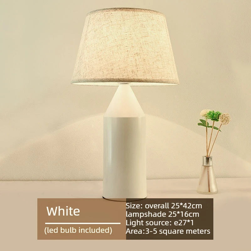 Black and white minimalist metal lamps displayed together on nightstands