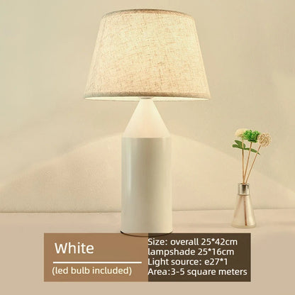 Black and white minimalist metal lamps displayed together on nightstands