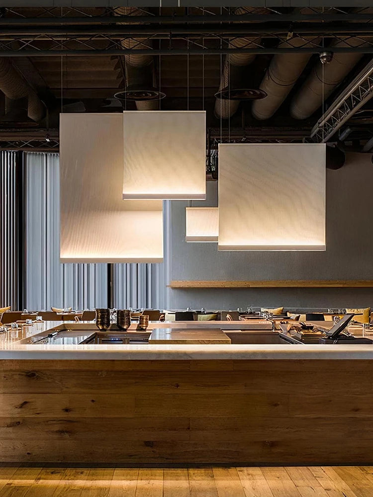 Wabi sabi fabric chandelier with plain dyed panels on steel