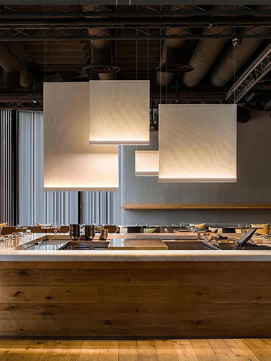 Wabi sabi fabric chandelier with plain dyed panels on steel